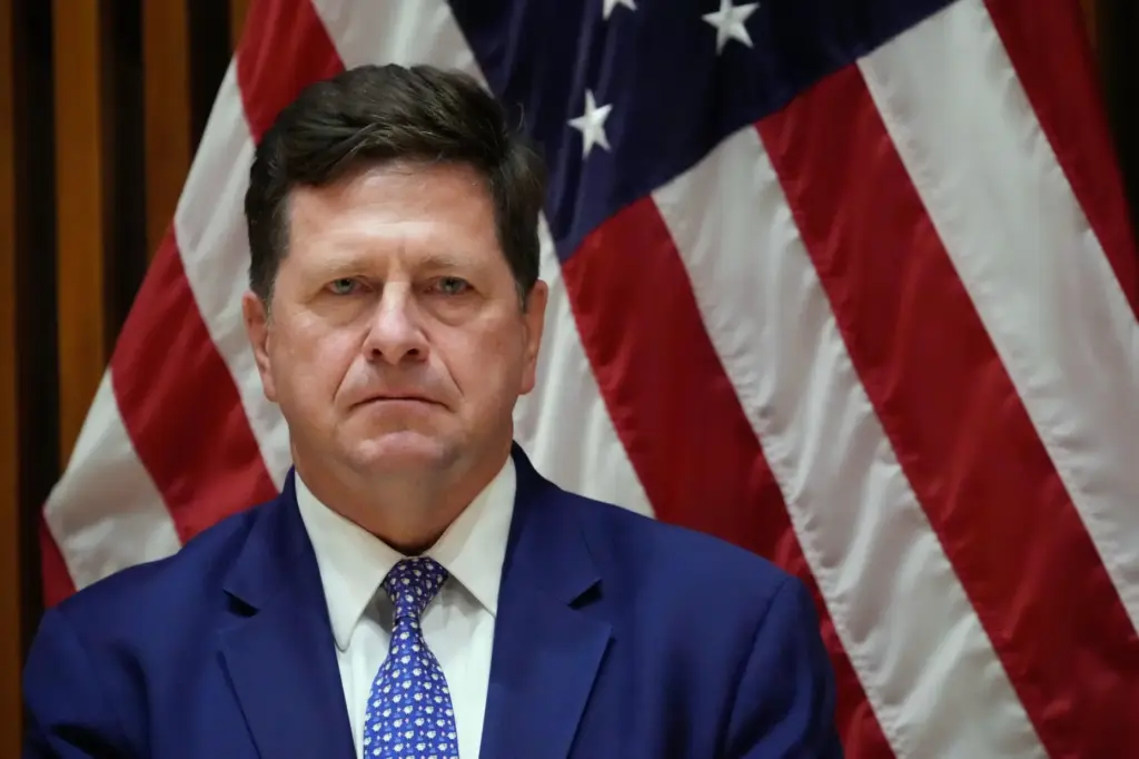 Jay Clayton, U.S. Attorney for the Southern District of New York, listens during a news conference.