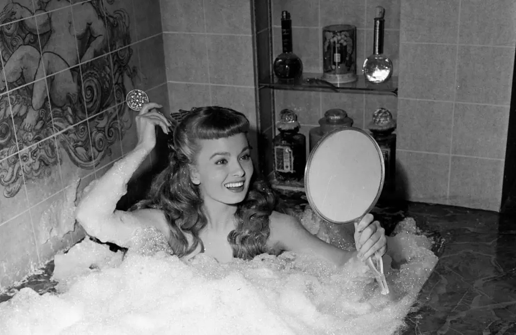 FILE – Actress Ann Blyth takes a bubble bath in...