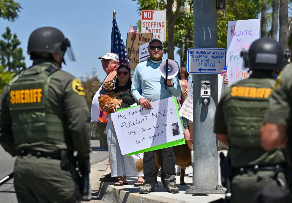 Protesters chant outside the Richard Nixon Presidential Library & Museum...