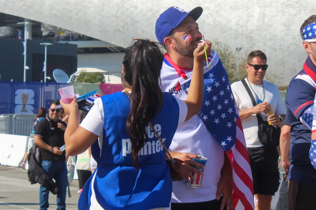 Some Team USA fans got their face painted outside of...