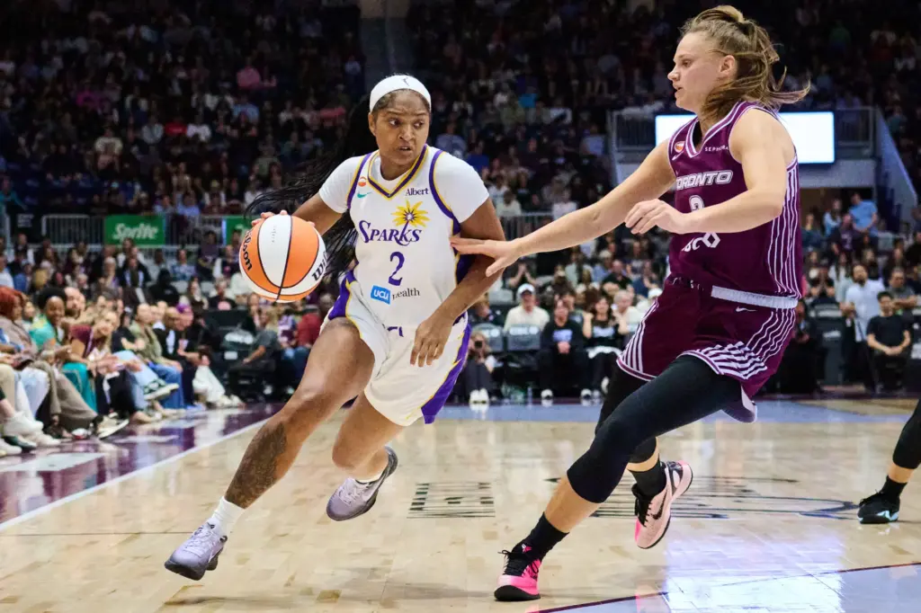 The Sparks’ Chance Gray, left, drives past the Toronto Tempo’s...
