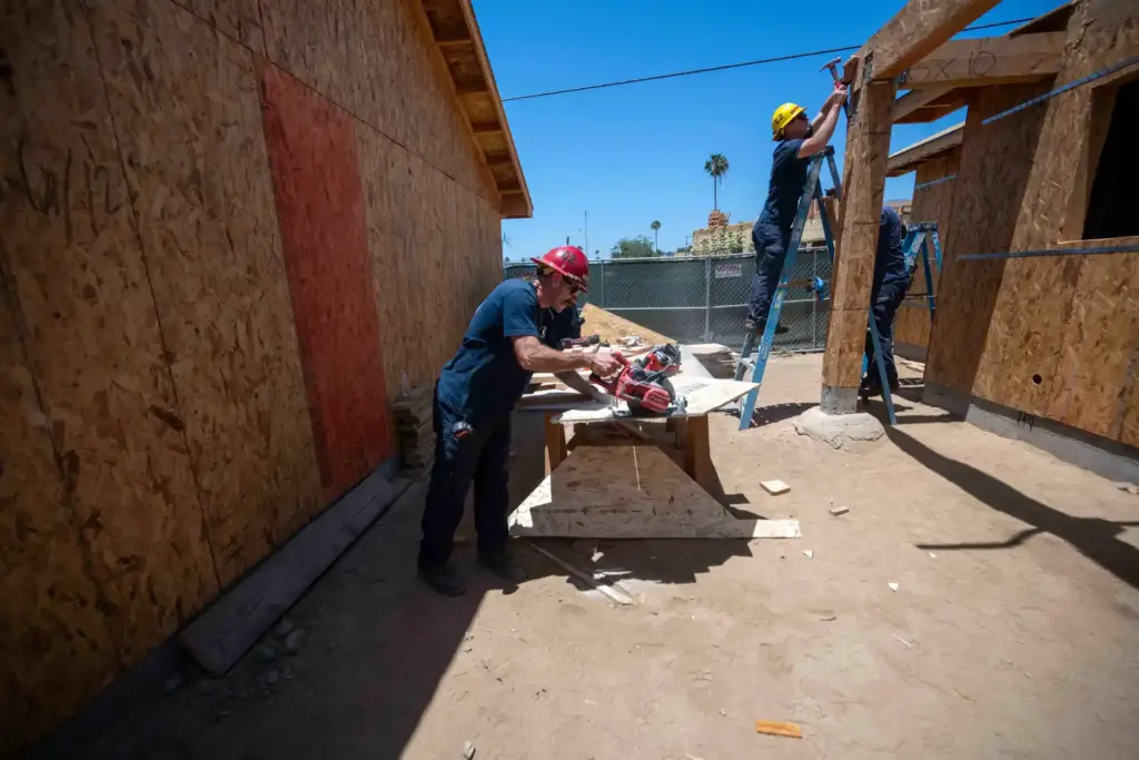 Members of the Los Angeles County Fire Department and Sheriff’s...