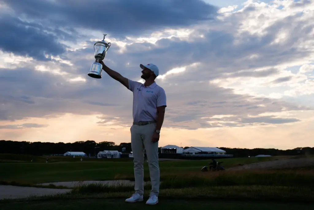 Wyndham Clark holds the trophy after winning the U.S. Open...