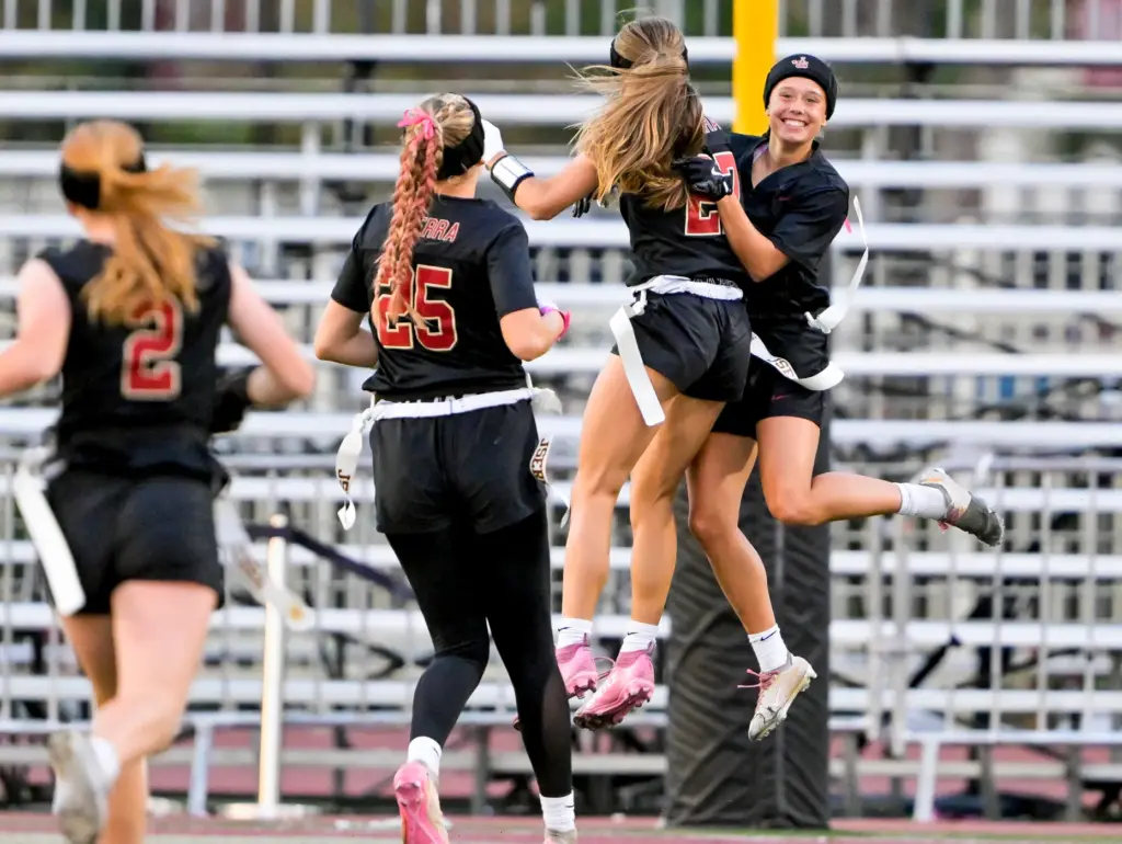 GG Szczuka (9), right, of JSerra celebrates with teammates after...