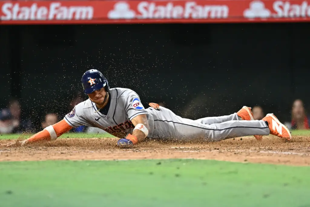 The Houston Astros’ Jeremy PeÃ±a scores the tying run during...