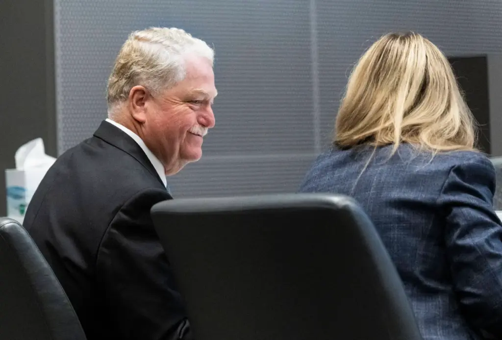 KC Roestenberg talks with a colleague before the OC Board...