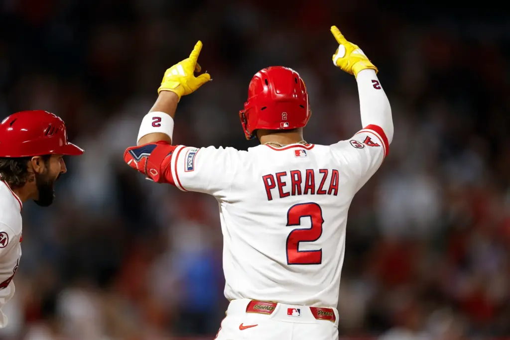 Angels’ Oswald Peraza (2) reacts after hitting a one-run single...