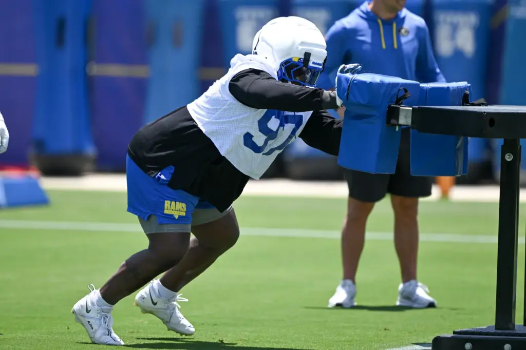 Rams defensive lineman Poona Ford works with the blocking sled...