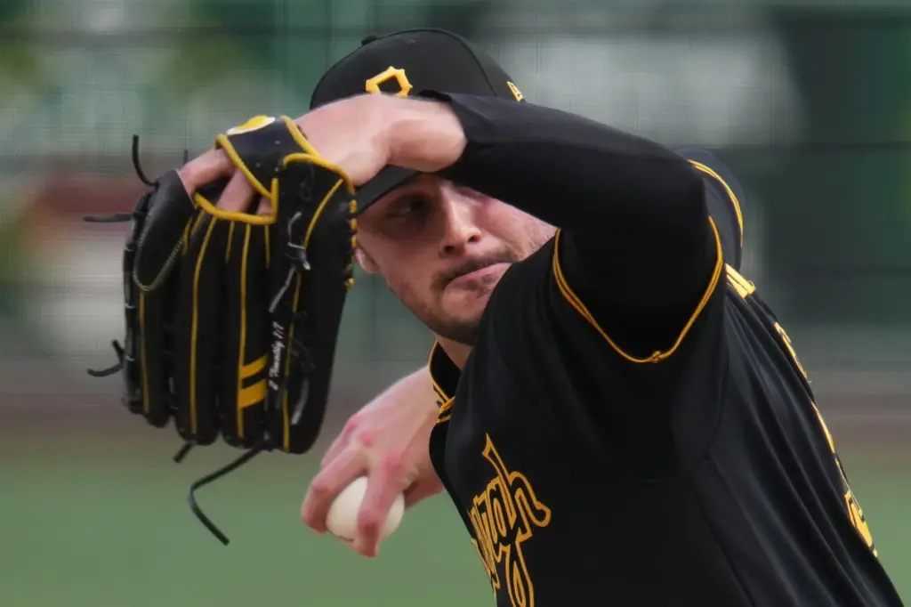 Pittsburgh Pirates starting pitcher Paul Skenes throws to the plate...