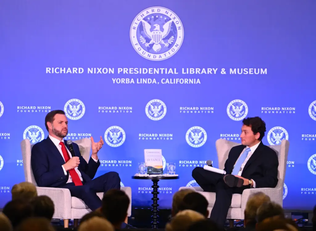 Vice President JD Vance chats with James Byron, President and...