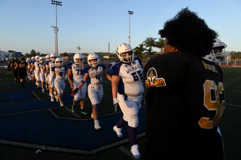 Cali War players greet their competitors after a loss against...