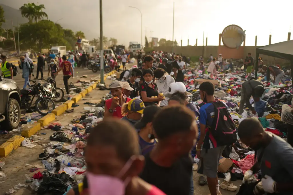 People affected by the earthquake line up for food in La Guaira, Venezuela.