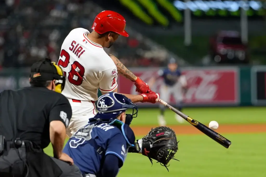 Angels’ Jose Siri, center, hits a two-run home run as...