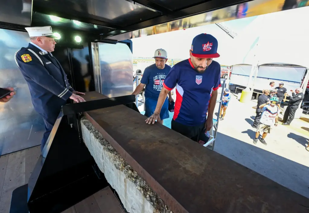 Retired NYFD firefighter Jimmy Maroldo stands by as Frank Ram...