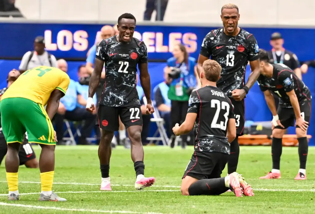 Canada defender Richie Laryea (23) celebrates with teammates Canada defender...