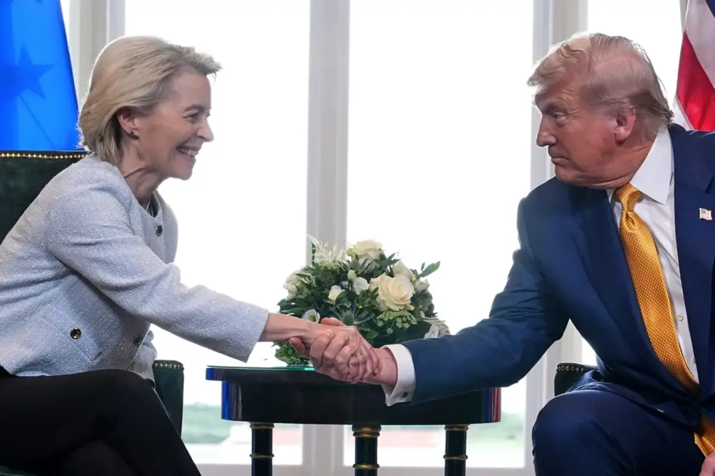 President Donald Trump and European Commission President Ursula von der Leyen shake hands.