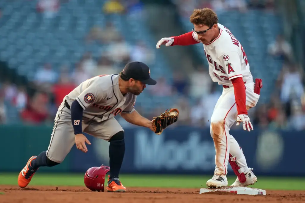 The Angels’ Wade Meckler, right, reaches second base ahead of...