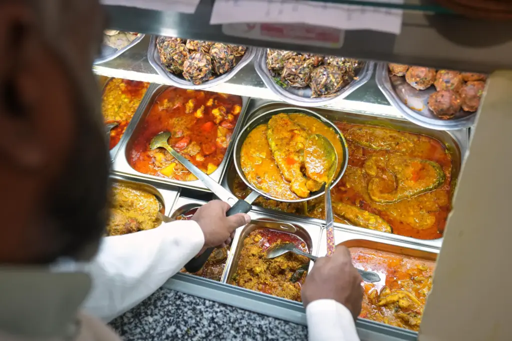 Chef Mohammed Shanoor Ali prepares food at a Bangladeshi restaurant...