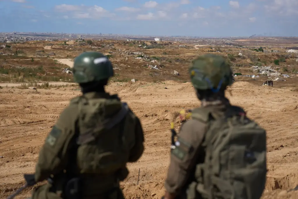 Israeli soldiers occupy a military position overlooking the so-called Yellow...