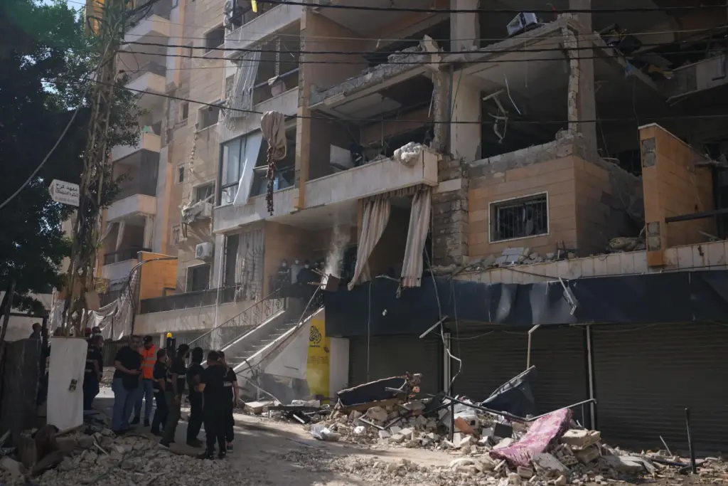 Lebanese security officers gather at the site where an Israeli...