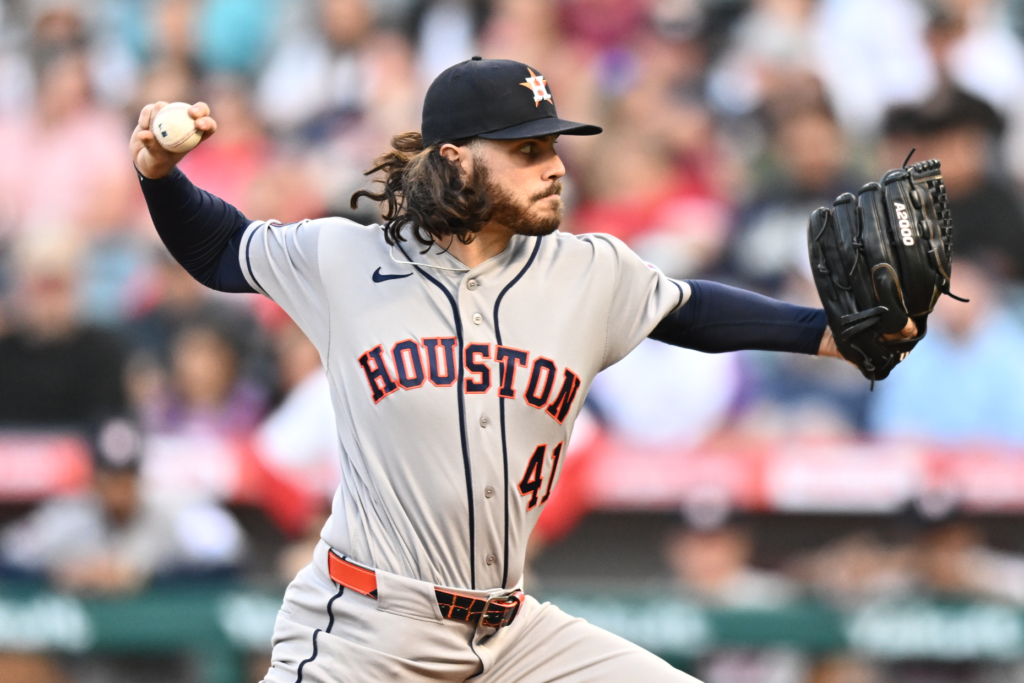 Houston Astros starting pitcher Spencer Arrighetti throws to the plate...
