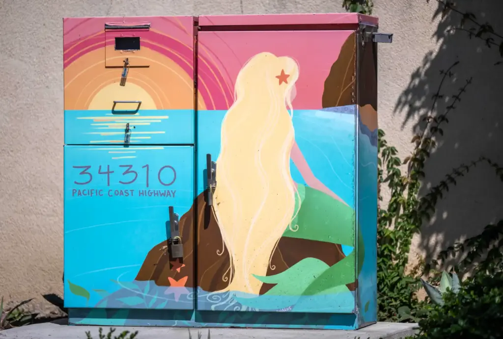 A painted utility box entitled âSunset Mermaid,â by artist Shayna...