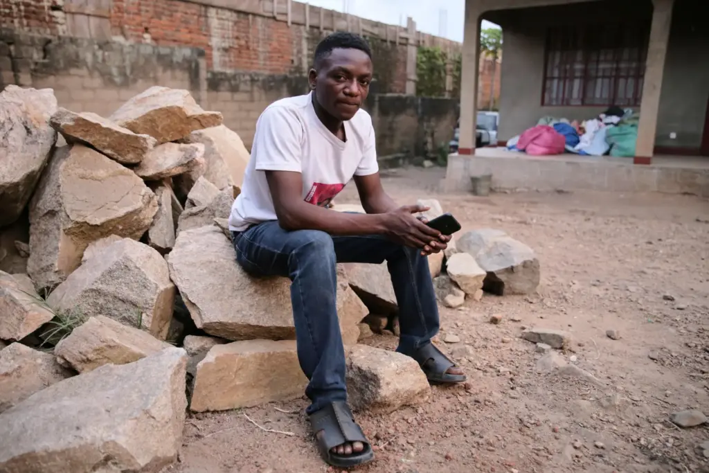 Bienfait Wanzire, an Ebola survivor, sits by his house in...