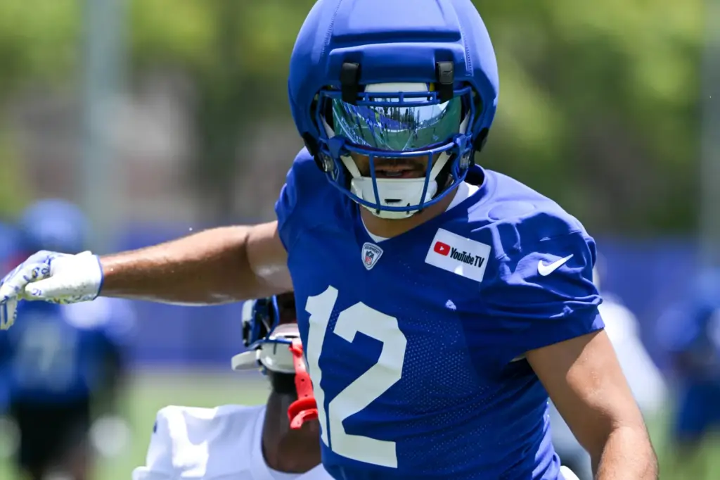 Rams wide receiver Puka Nacua goes through drills during an...