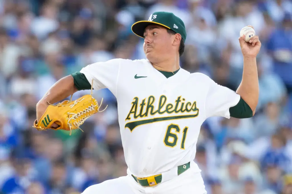 A’s starting pitcher Gage Jump throws to the plate during...