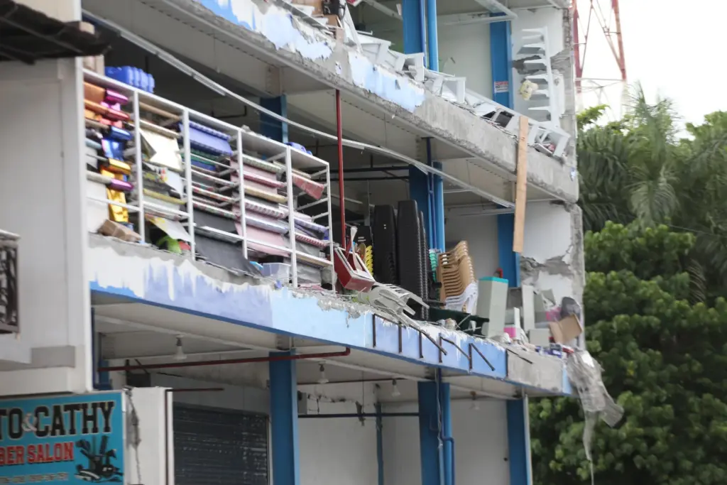 A building is damaged after an earthquake in General Santos,...