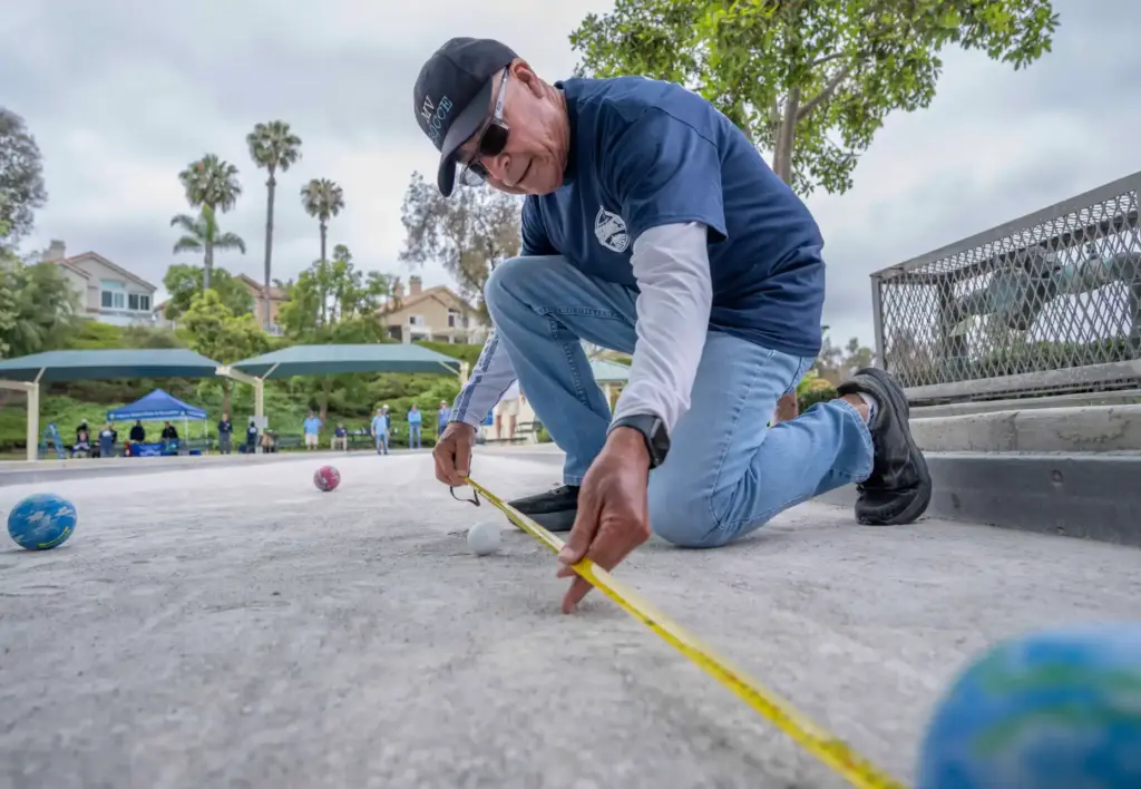 Referee Sergio Robleto of Mission Viejo measures to see whose...
