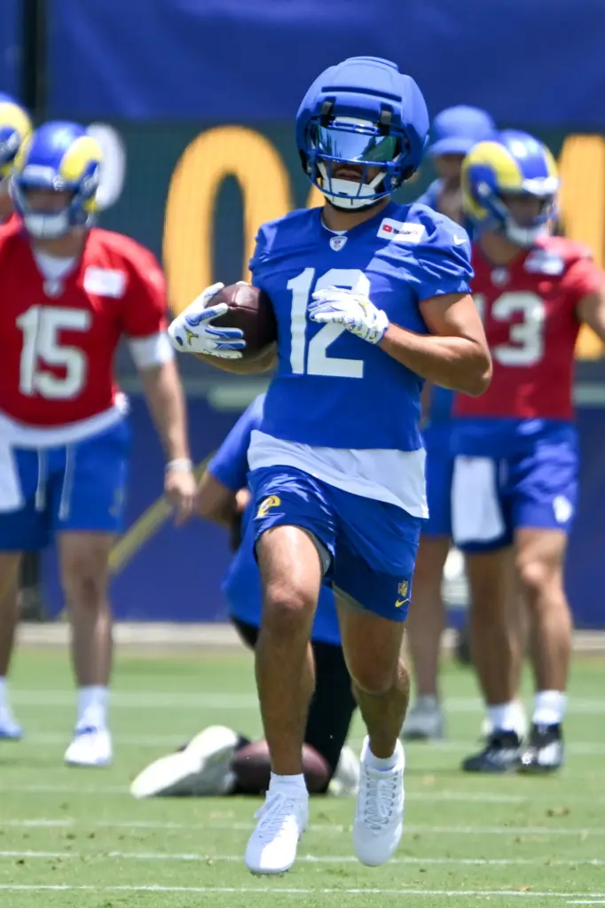 Rams wide receiver Puka Nacua goes through drills during an...