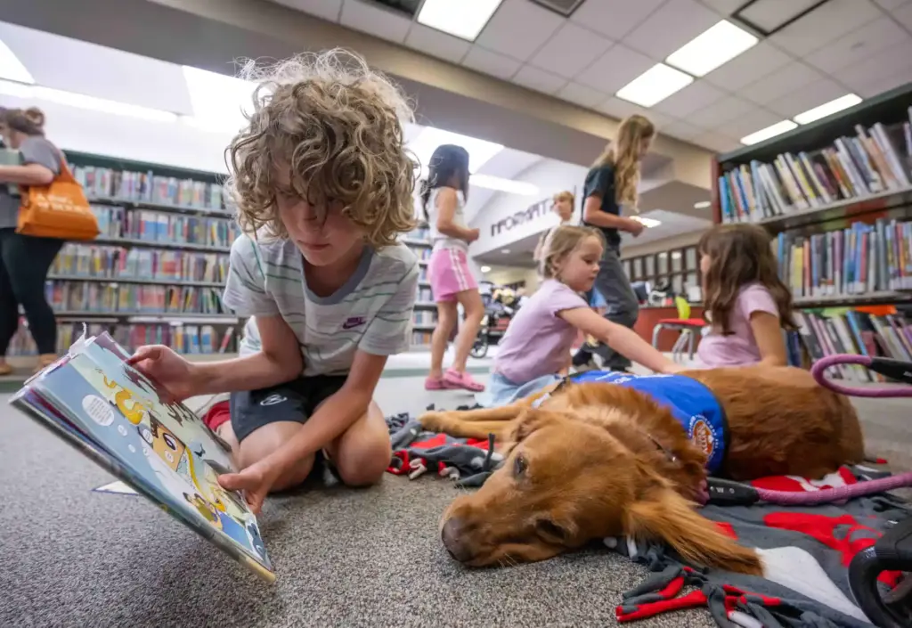 Logan Kalscheuer, 9, of Ladera Ranch, reads a childrenâs book...