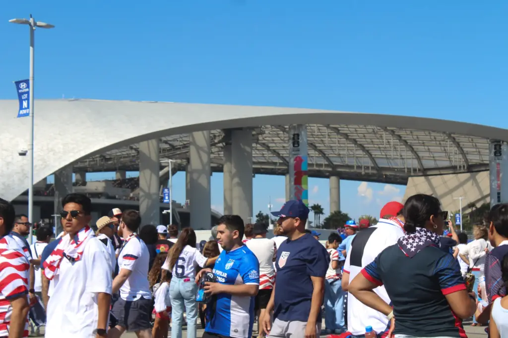 Fans walking to the Los Angeles Stadium on Friday, June...