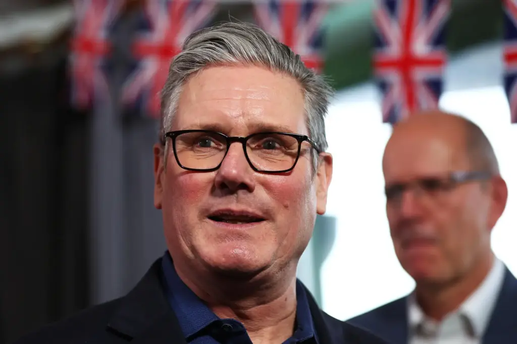 Britain's Prime Minister Keir Starmer talks with members of the audience after delivering a speech.