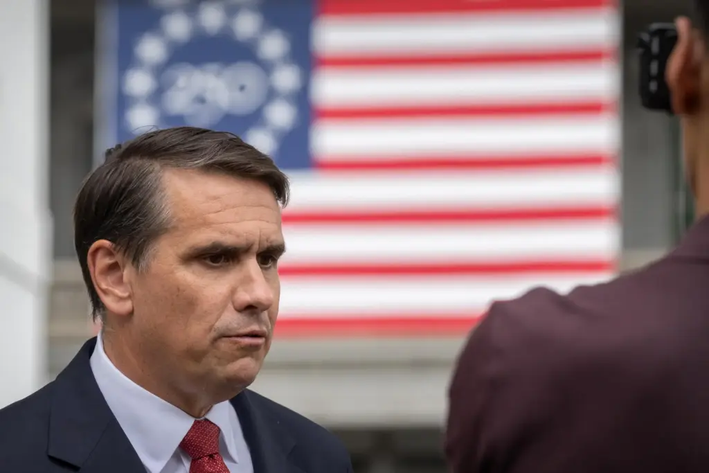 Acting Attorney General Todd Blanche speaks to a reporter outside the White House.
