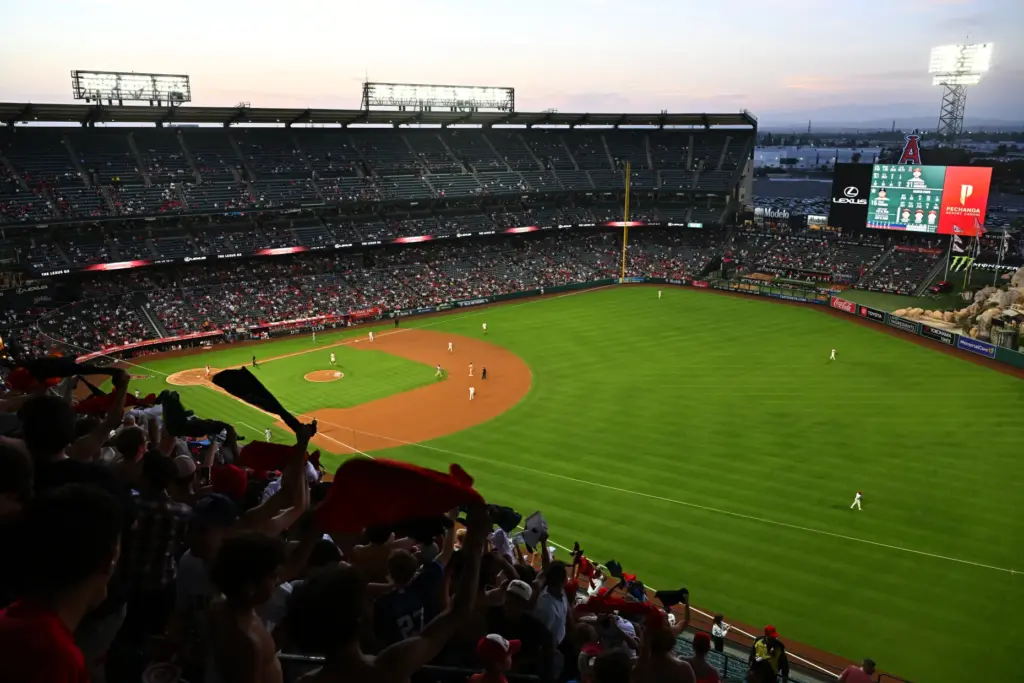 Fans participate in “tarps off” during the sixth inning of...