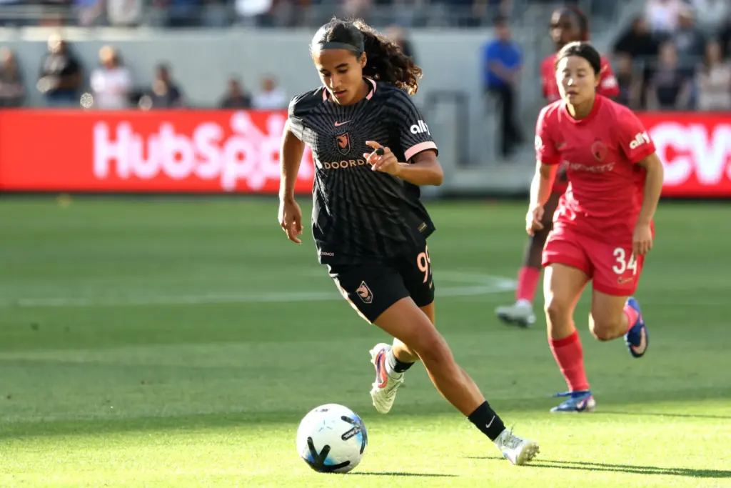 Angel City FC midfielder Taylor Suarez controls the ball against...
