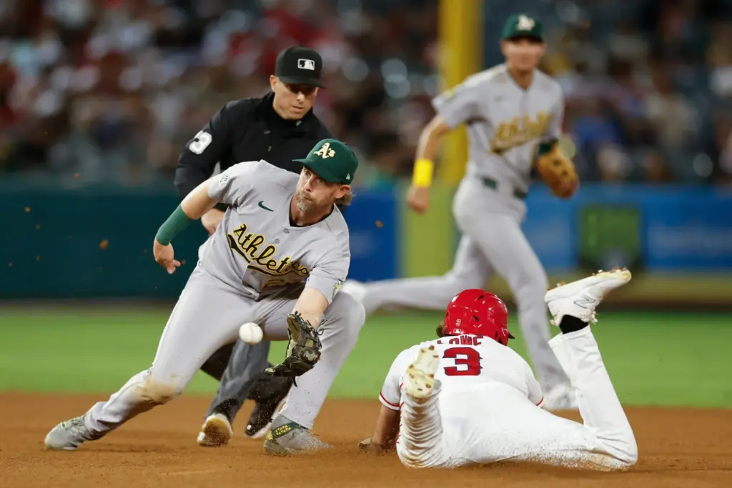 Angels’ Josh Lowe (3) slides into second base as Athletics...