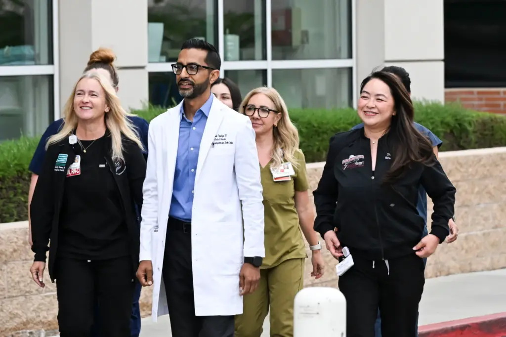 Dr. Adeel Popalzai, medical director of neurology, and members of...