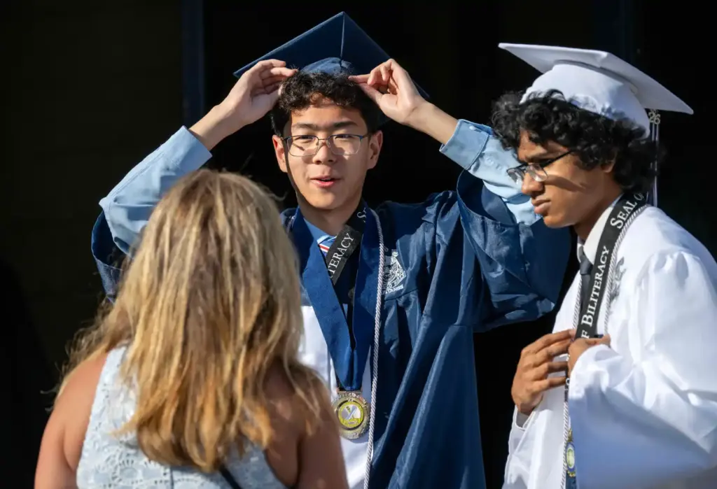 Graduates get ready for their commencement ceremony at Trabuco Hills...