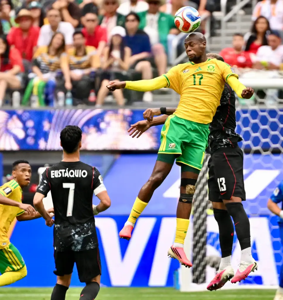 South Africa forward Evidence Makgopa (17) with the header over...