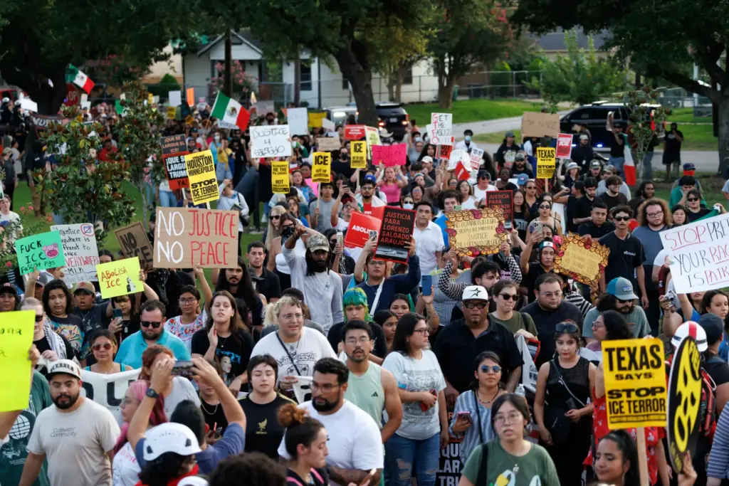 People march during a vigil for Lorenzo Salgado Araujo, a...