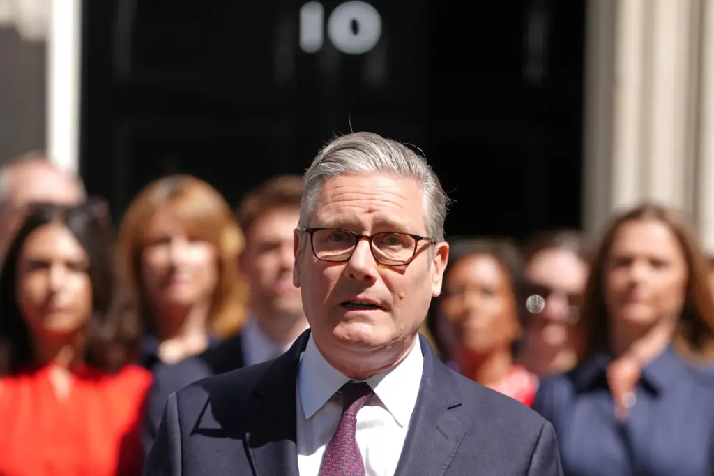 Britain's outgoing Prime Minister Keir Starmer speaks as he leaves 10 Downing Street.