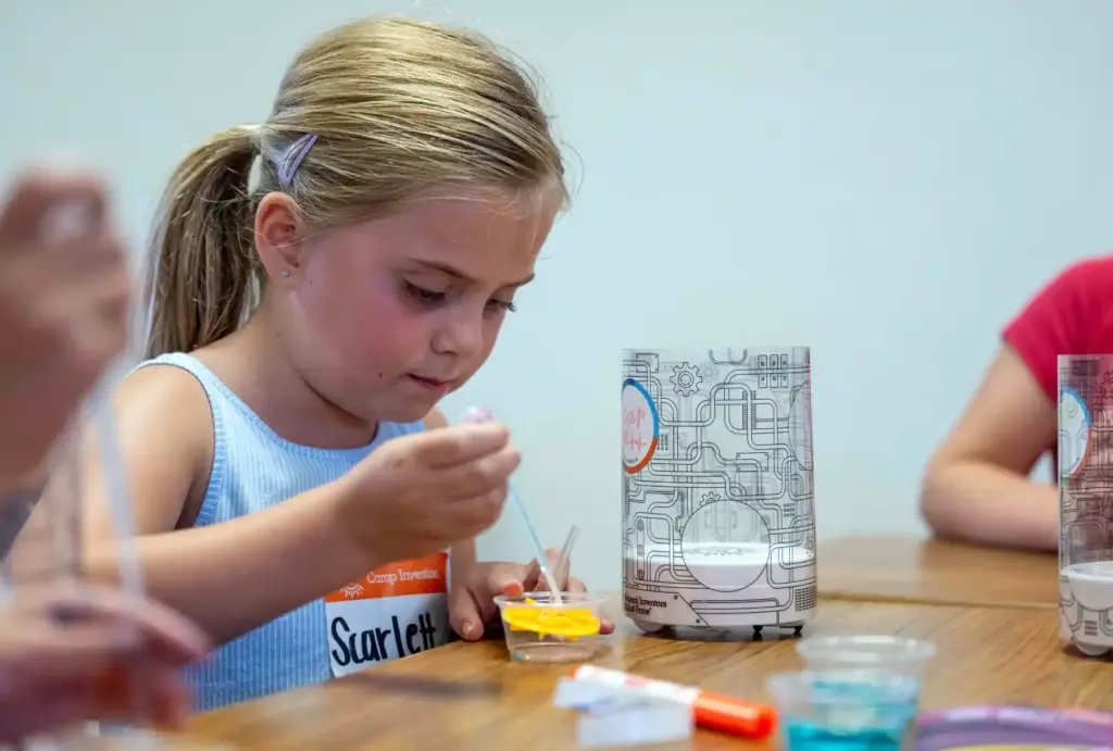 Scarlett Jackson, 6, of Ladera Ranch uses a pipette to...