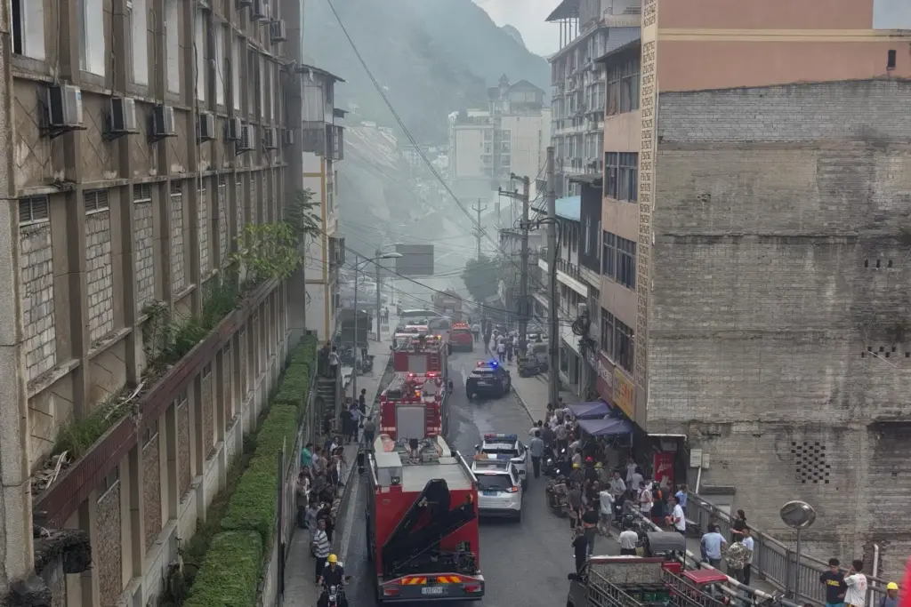 This photo taken and provided by Mimosa shows firefighters arrive...