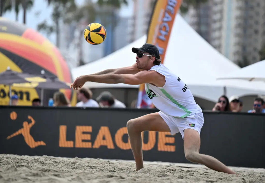 Logan Webber, with L.A. Launch, digs for the ball against...