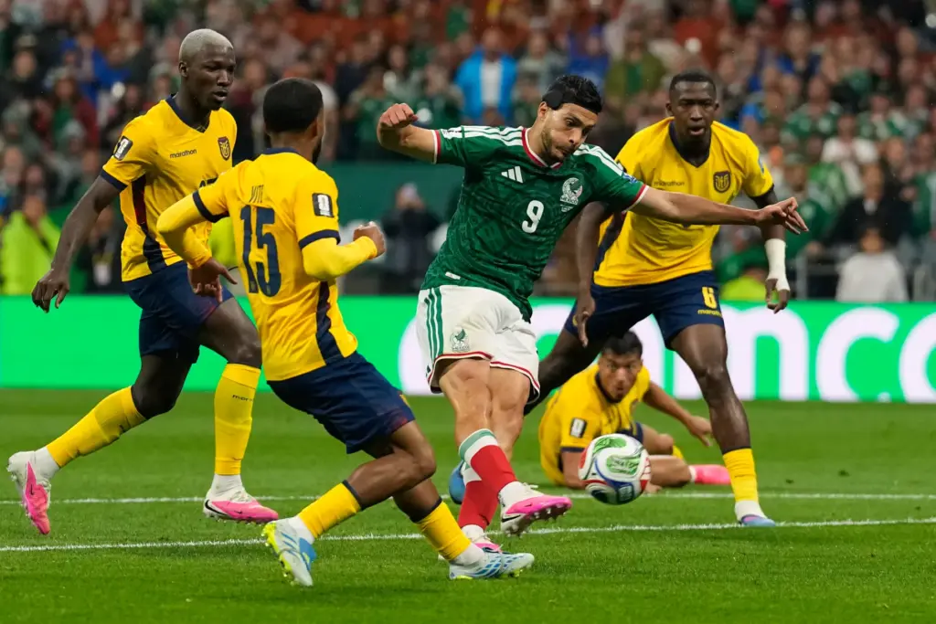 Mexico’s Raul Jimenez, center, scores his side’s second goal past...