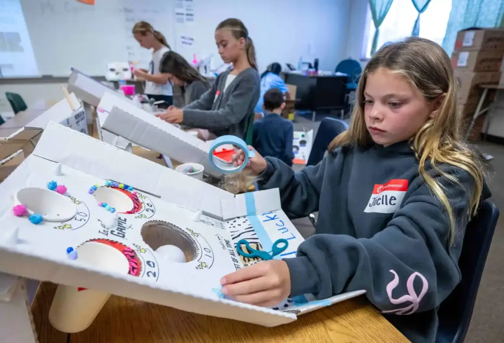 Joelle McLatcher, 9, of Ladera Ranch works on creating a...