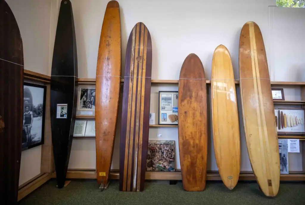 A lineup of vintage wooden longboards that will be part...